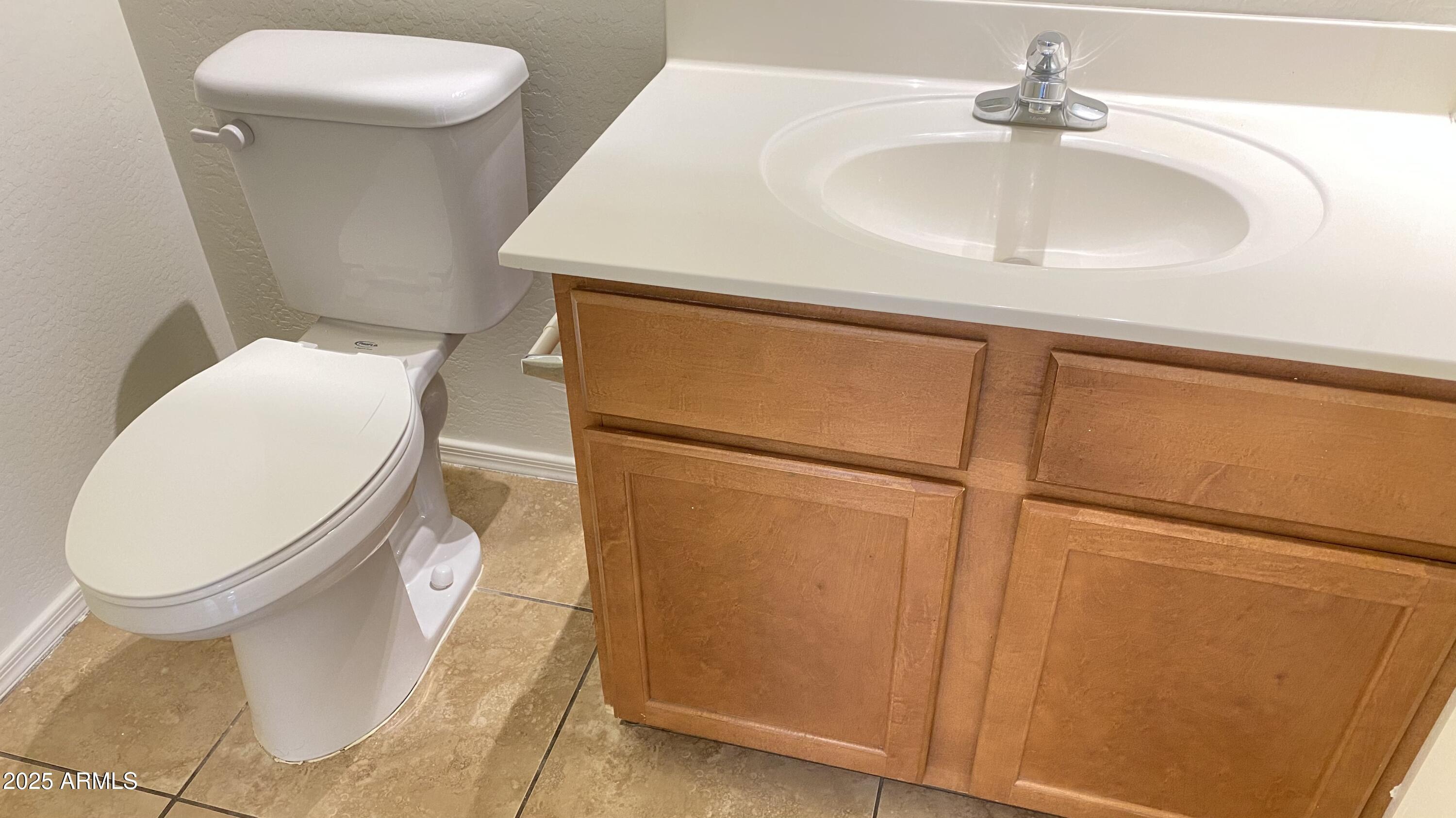 7425 West Crown King Road Phoenix, AZ 85043 - Photo 26 of 27 a bathroom with a sink and a toilet