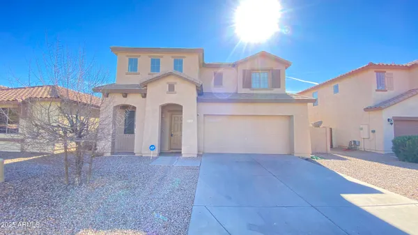 a view of a house with a yard and garage