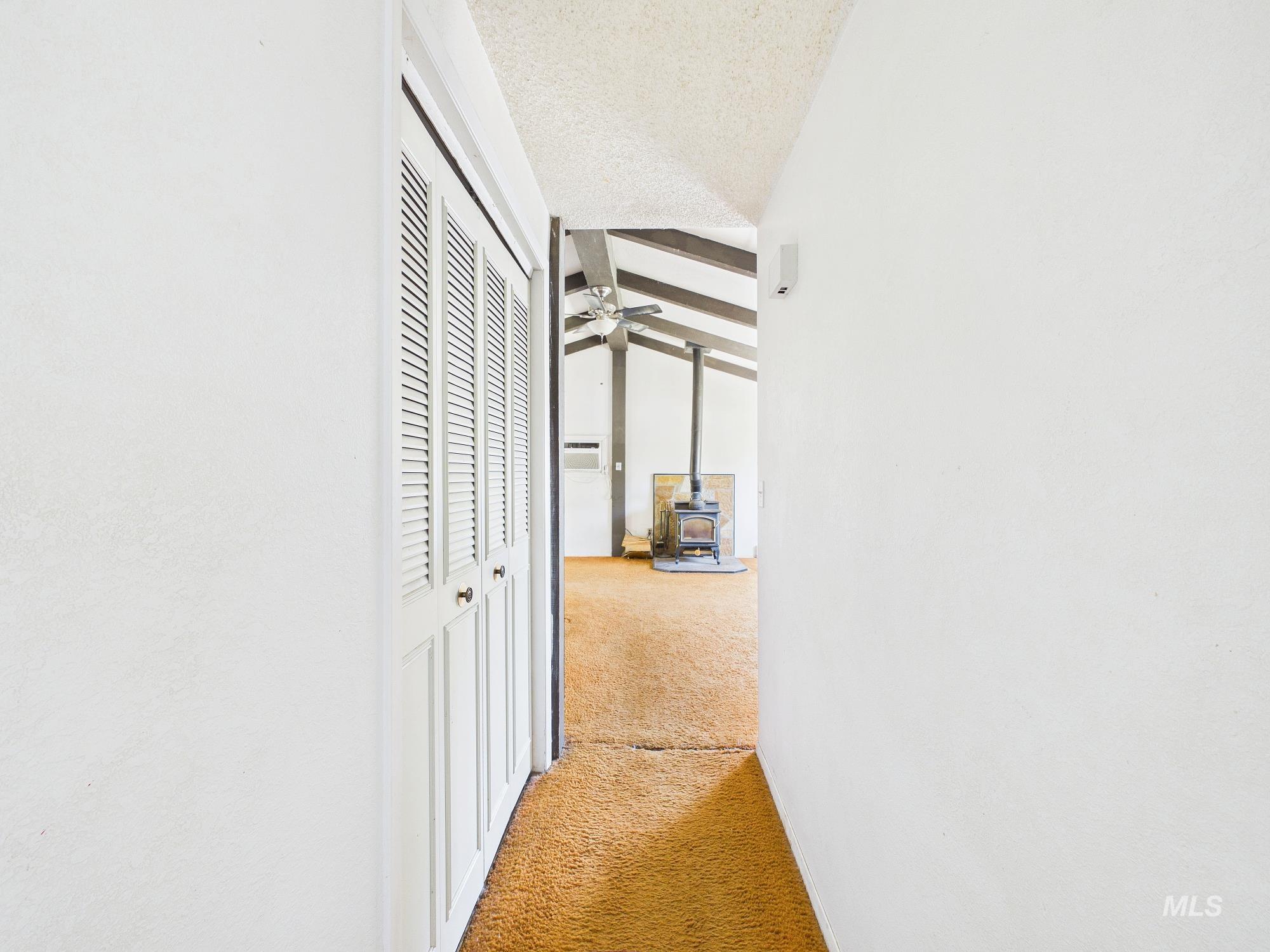 1527 North Plaza Road Emmett, ID 83617 - Photo 28 of 33 Hallway featuring louvered bi-fold doors