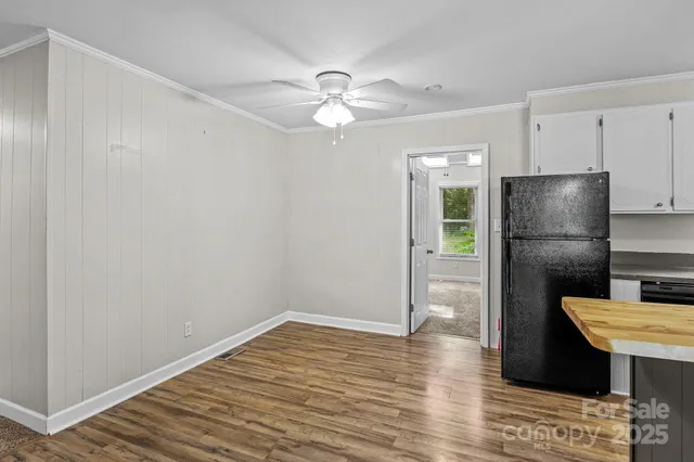 a kitchen with a refrigerator and a microwave