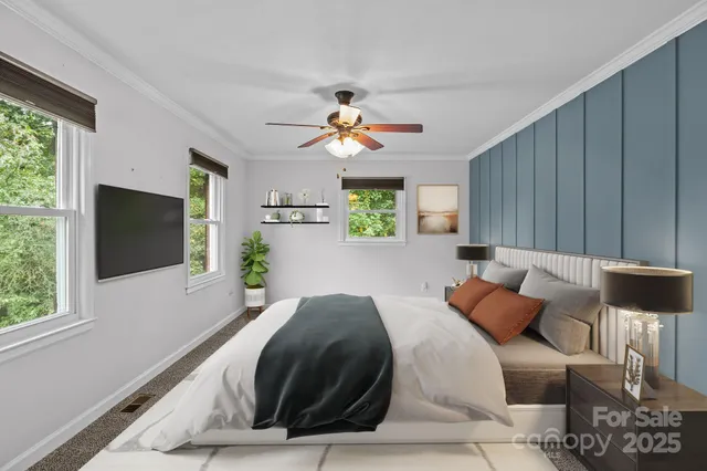 a bedroom with a bed and a flat screen tv