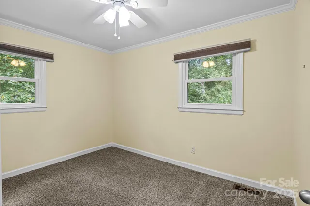 a bathroom with a granite countertop sink toilet a mirror and shower