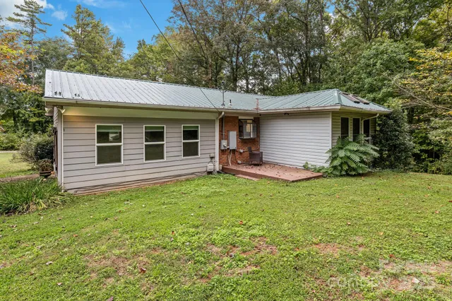 a backyard of a house with seating space
