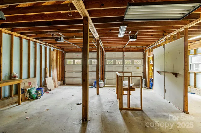 a view of a storage room with wooden floor and furniture