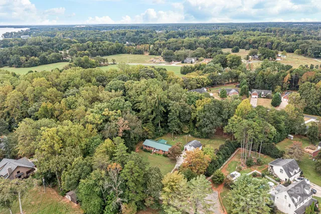 an aerial view of a houses with yard