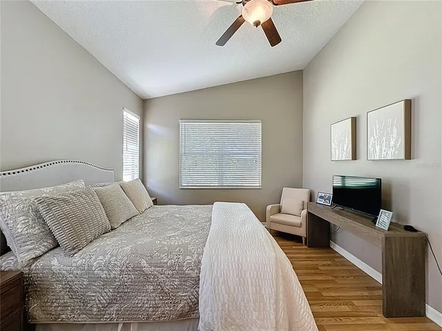 a living room with furniture and floor to ceiling window