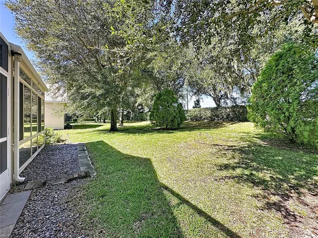 an aerial view of multiple house with yard