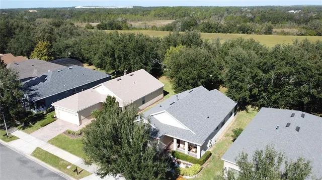 a view of a lake with a house in the background