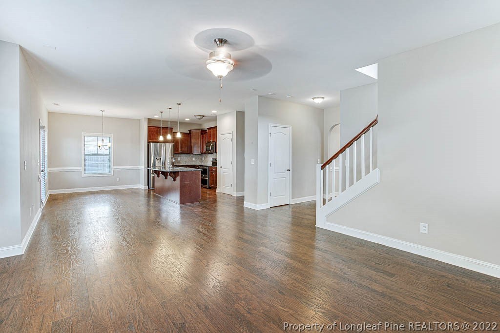 268 Turriff Way Cameron, NC 28326 - Photo 12 of 44 a view of an empty room with wooden floor and a window