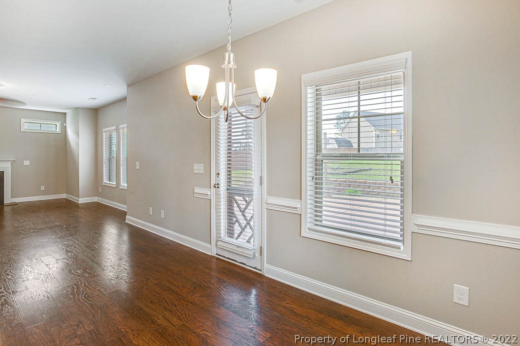 268 Turriff Way Cameron, NC 28326 - Photo 17 of 44 a view of a livingroom with wooden floor and a large window