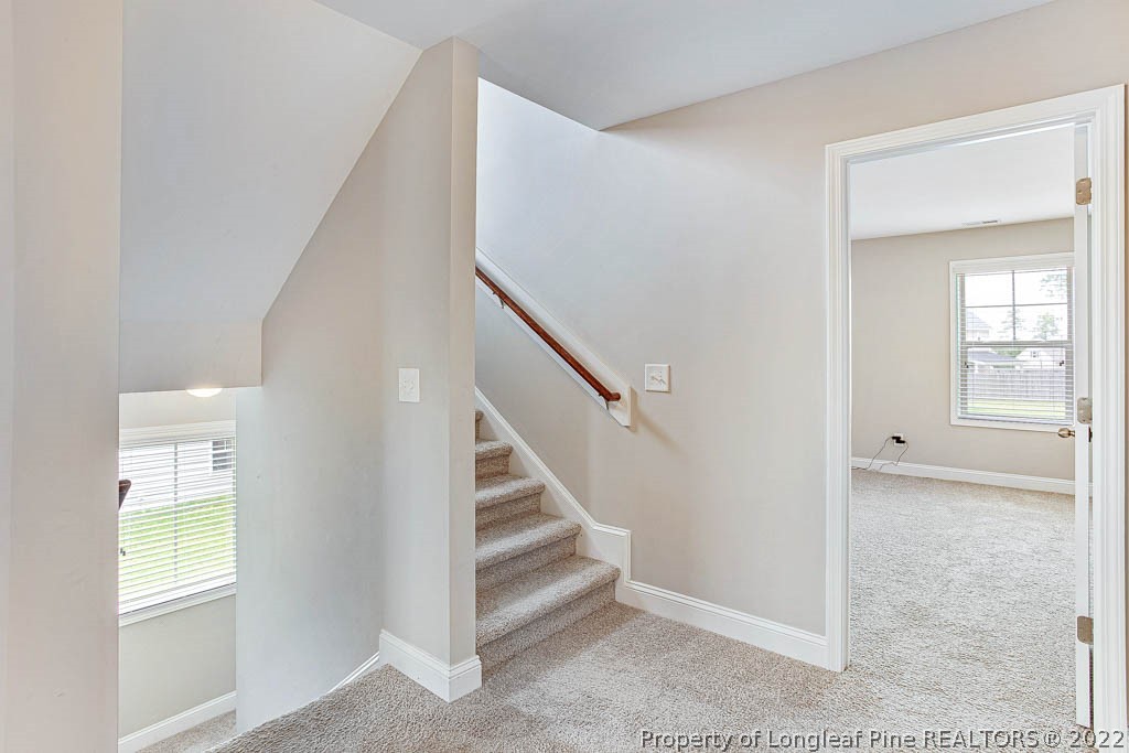 268 Turriff Way Cameron, NC 28326 - Photo 19 of 44 a view of entryway with wooden floor and stairs