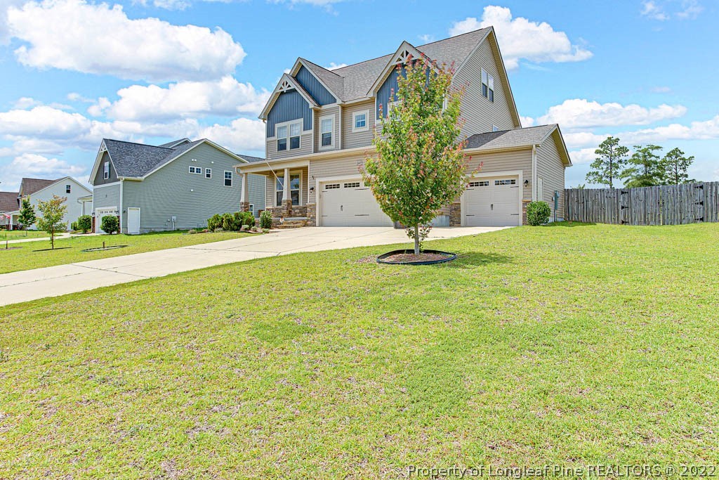 268 Turriff Way Cameron, NC 28326 - Photo 2 of 44 a front view of house with yard and trees