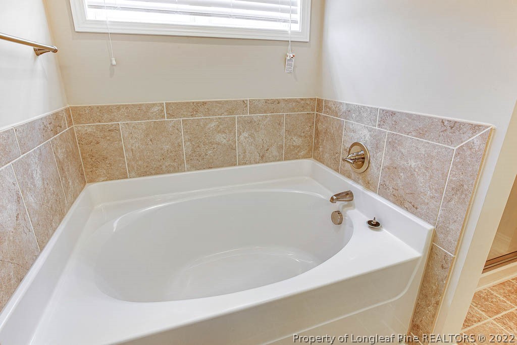 268 Turriff Way Cameron, NC 28326 - Photo 23 of 44 a bathroom with a bathtub