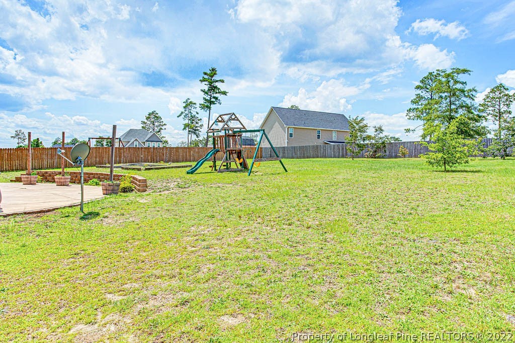 268 Turriff Way Cameron, NC 28326 - Photo 39 of 44 a view of a houses with a yard