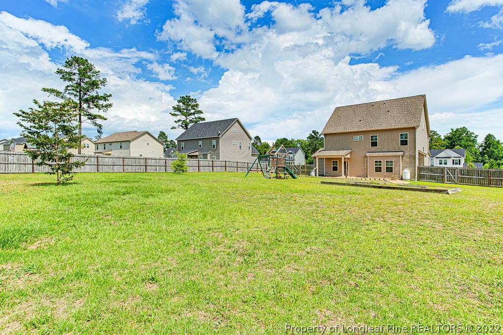 268 Turriff Way Cameron, NC 28326 - Photo 42 of 44 a house view with a garden space
