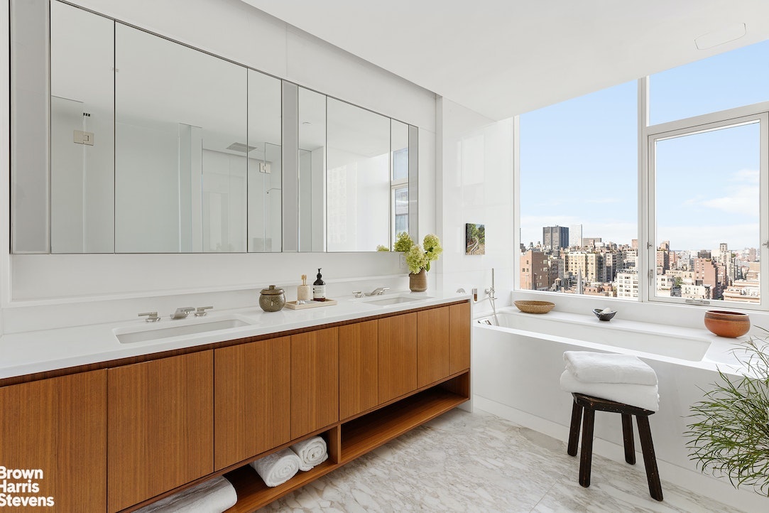 1289 Lexington Avenue, Unit PHA Manhattan, NY 10028 - Photo 8 of 21 a bathroom with a sink and a mirror
