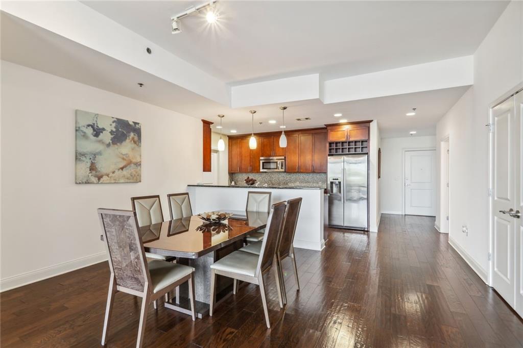 270 17th Street Northwest Atlanta, GA 30363 - Photo 3 of 15 a view of a dining room with furniture and wooden floor