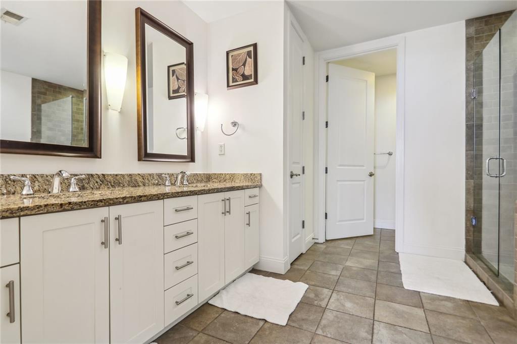 270 17th Street Northwest Atlanta, GA 30363 - Photo 7 of 15 a bathroom with a granite countertop sink mirror and