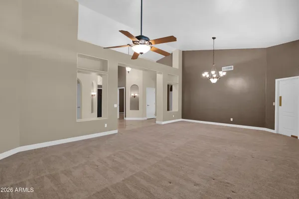 a kitchen with a sink dishwasher and a stove with wooden cabinets