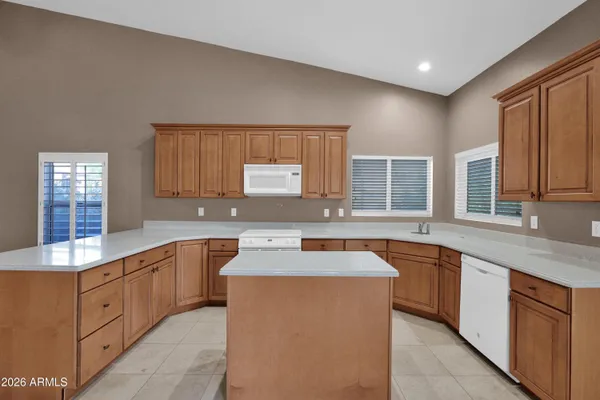 a spacious bathroom with a mirror and a shower
