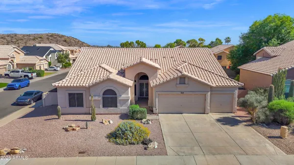 front view of a house with a garden