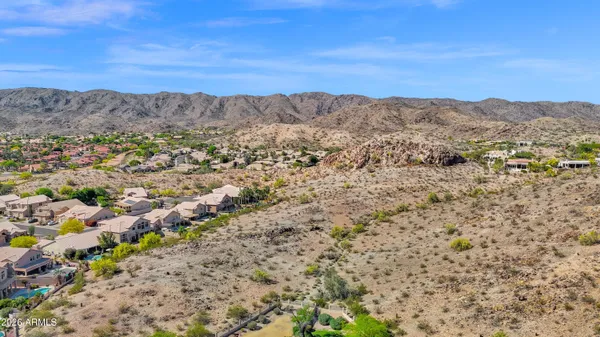 a view of mountains and a mountain in the distance