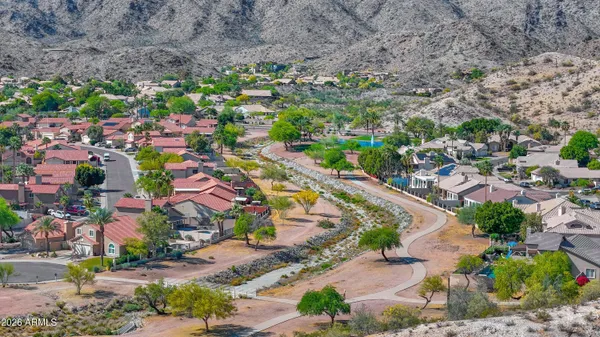 a aerial view of a house with a yard and plants