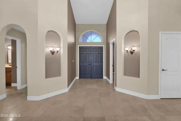 a view of an empty room with a ceiling fan