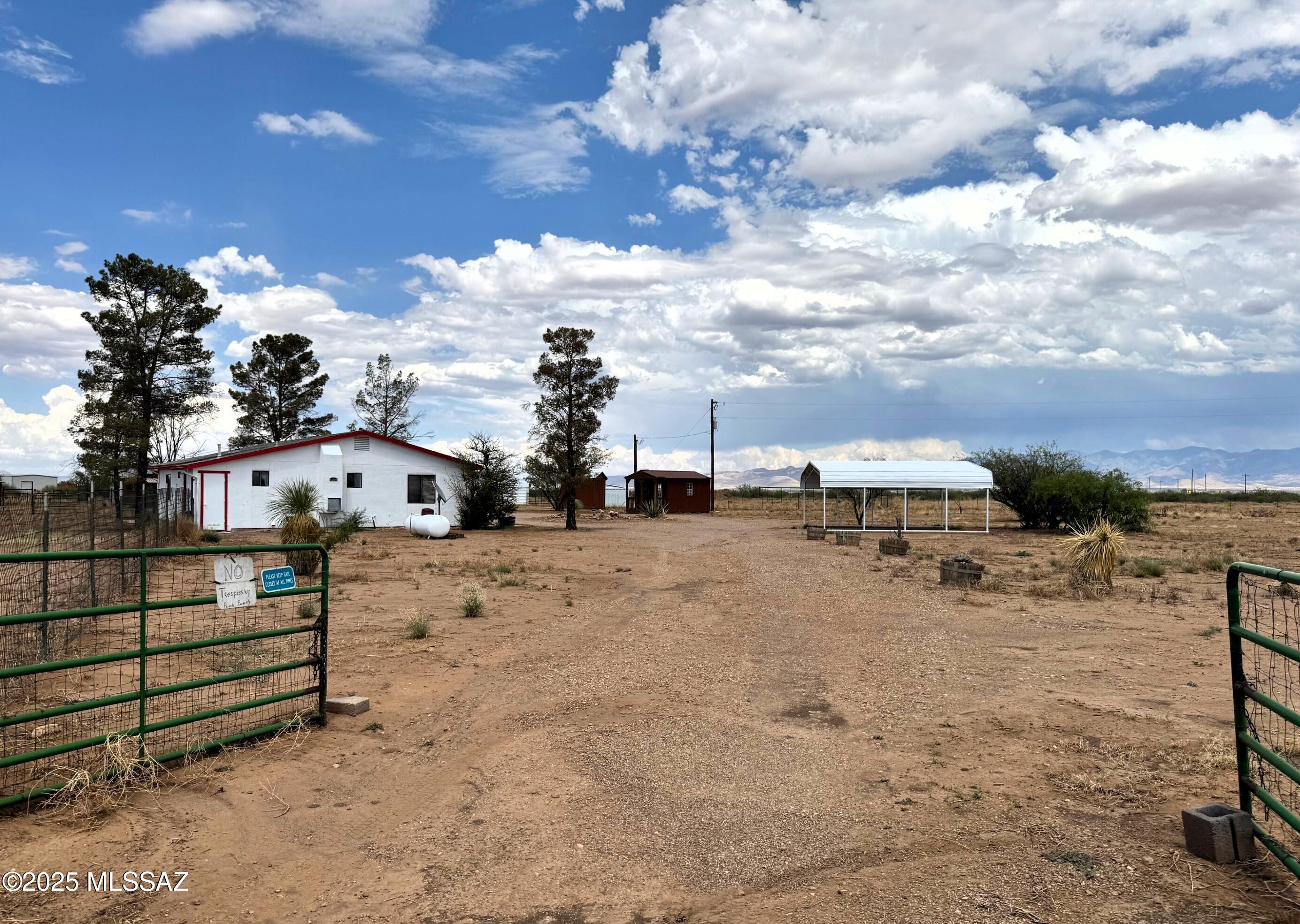 13384 South Cottonwood Road Pearce, AZ 85625 - Photo 3 of 46 a view of a house with a yard