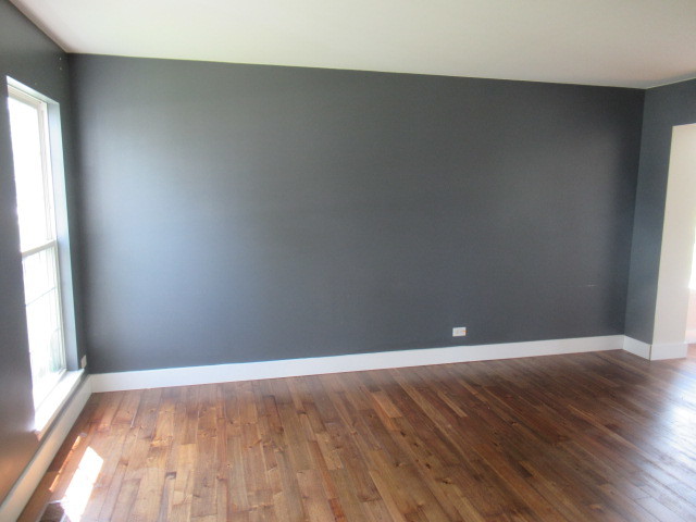 508 Ramsden Road Plano, IL 60545 - Photo 4 of 31 a view of an empty room with wooden floor and a window