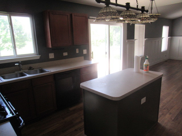 508 Ramsden Road Plano, IL 60545 - Photo 9 of 31 a kitchen with a sink a window and cabinets