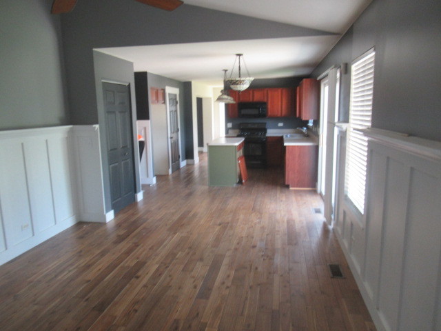 508 Ramsden Road Plano, IL 60545 - Photo 10 of 31 a view of a kitchen with wooden floor