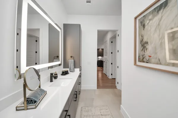 a living room with furniture fireplace and large windows