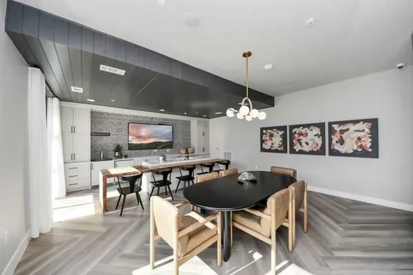 a kitchen with stainless steel appliances kitchen island granite countertop a refrigerator and a stove top oven