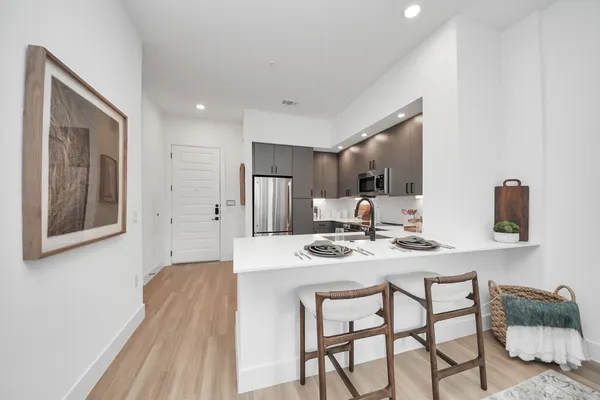 a bedroom with a bed and a dresser