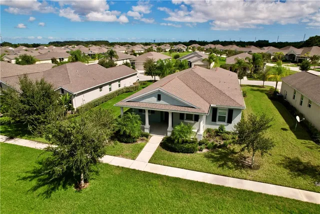 an aerial view of house with yard swimming pool and outdoor seating