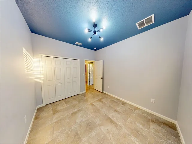 a view of a livingroom with a ceiling fan and window