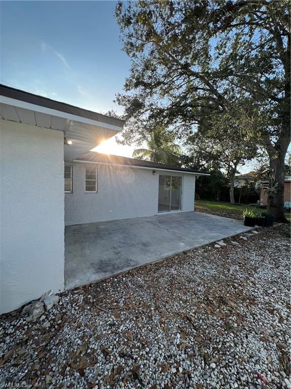 5345 Hardee Street Naples, FL 34113 - Photo 4 of 20 a view of a backyard with large trees