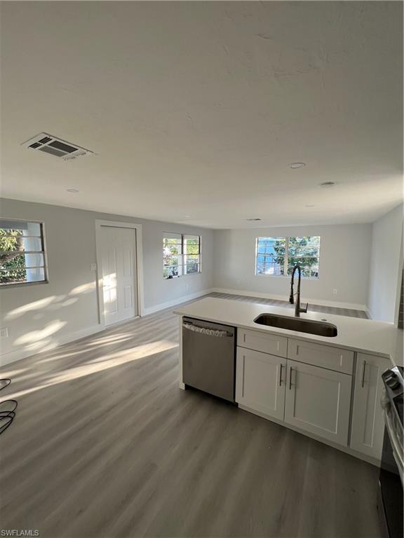 5345 Hardee Street Naples, FL 34113 - Photo 6 of 20 a spacious bathroom with a double vanity sink and a mirror