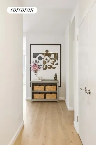 a bathroom with a tub sink a mirror a double vanity and a shower