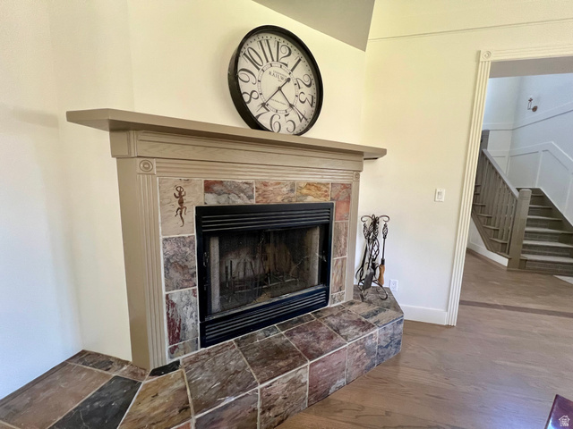 812 East Bates Cyn Road Tooele, UT 84074 - Photo 14 of 144 Fireplace with a decorative mantel and a stone tile surround, complemented by a matching stone hearth