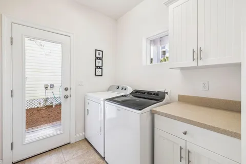 a kitchen with a stove and a white cabinet