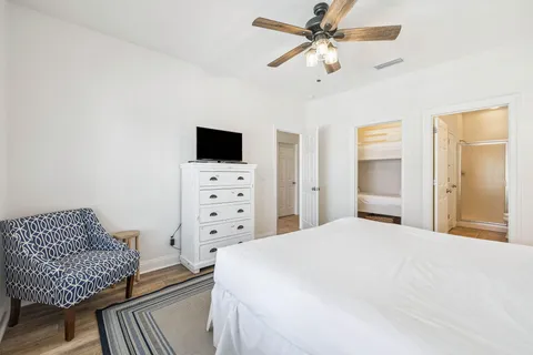 a bedroom with a bed and a television