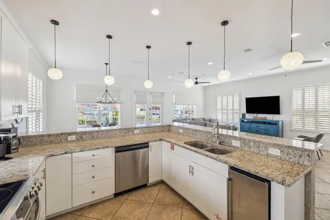 a kitchen with a sink and a large window