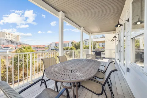 a view of a balcony with furniture