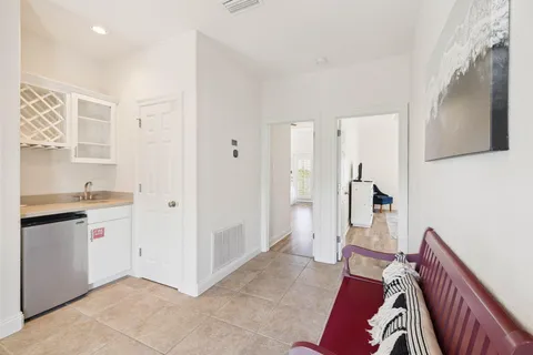 a view of room with cabinets and wooden floor