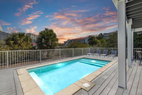 a view of a backyard with swimming pool