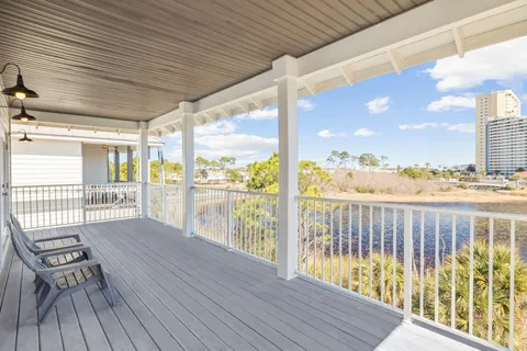 a view of a balcony with wooden floor