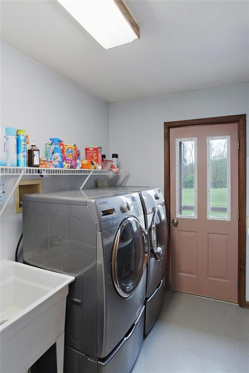 576 New Texas Road Pittsburgh, PA 15239 - Photo 23 of 25 First floor laundry room with walkout door to rear yard.