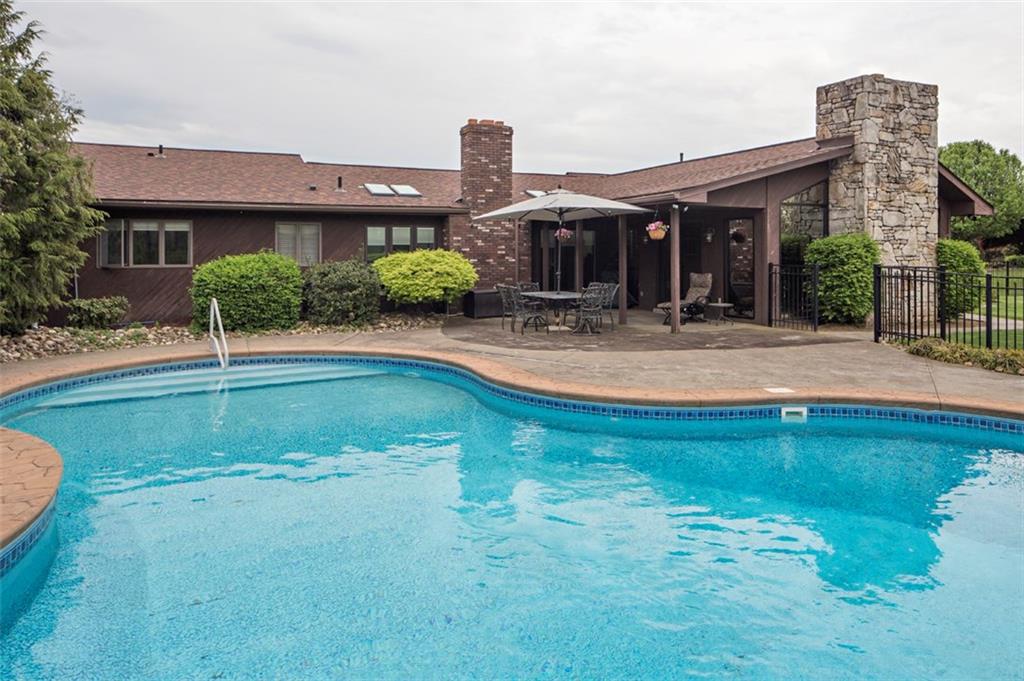 576 New Texas Road Pittsburgh, PA 15239 - Photo 24 of 25 Salt Water, heated, low maintenance inground pool-note covered patio off family room.
